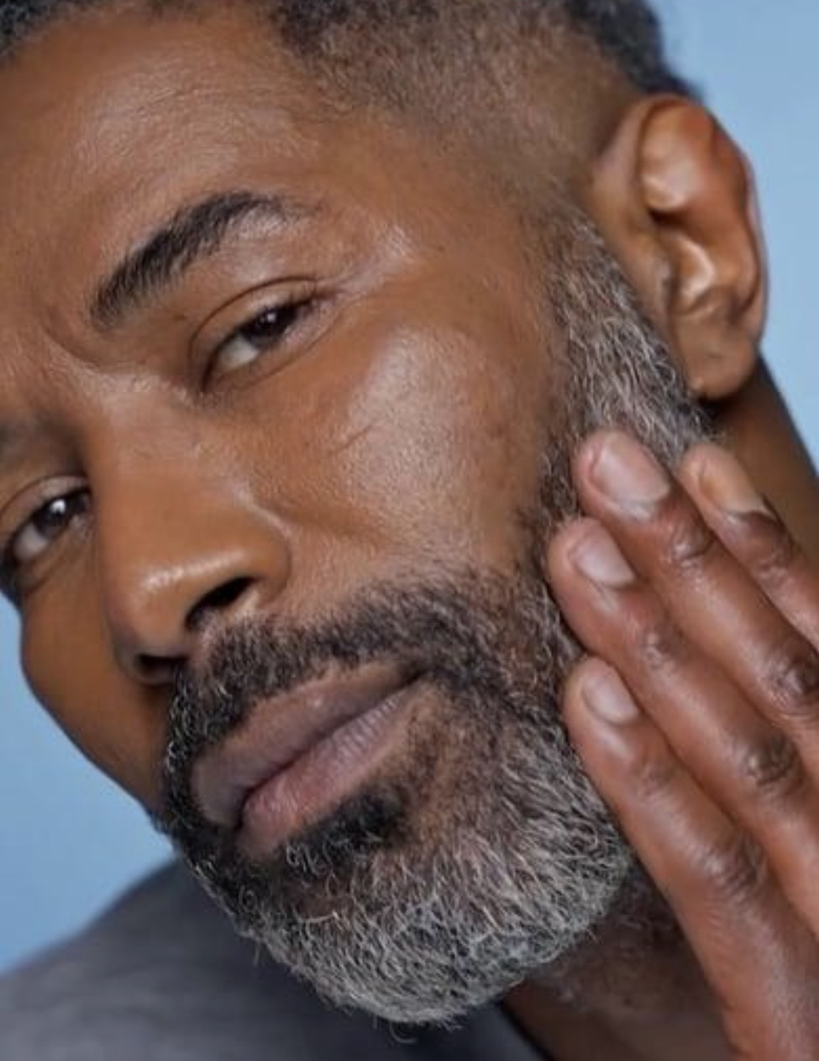 Man caring for a mature gray beard